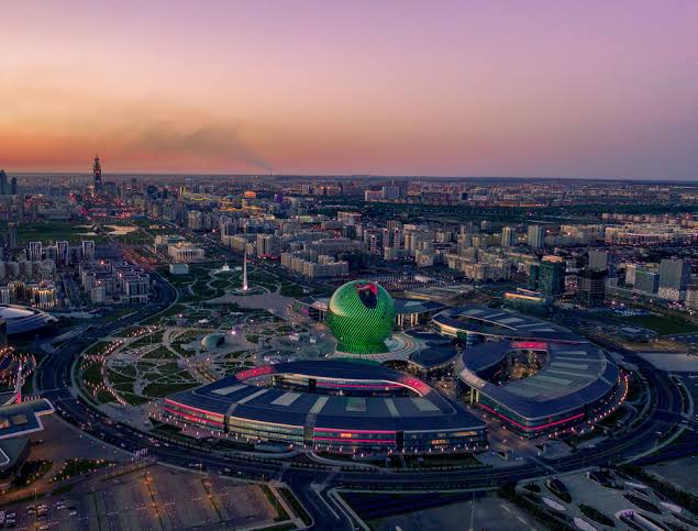 Aerial view of the EXPO 2017 site and Nur Alem sphere at dusk